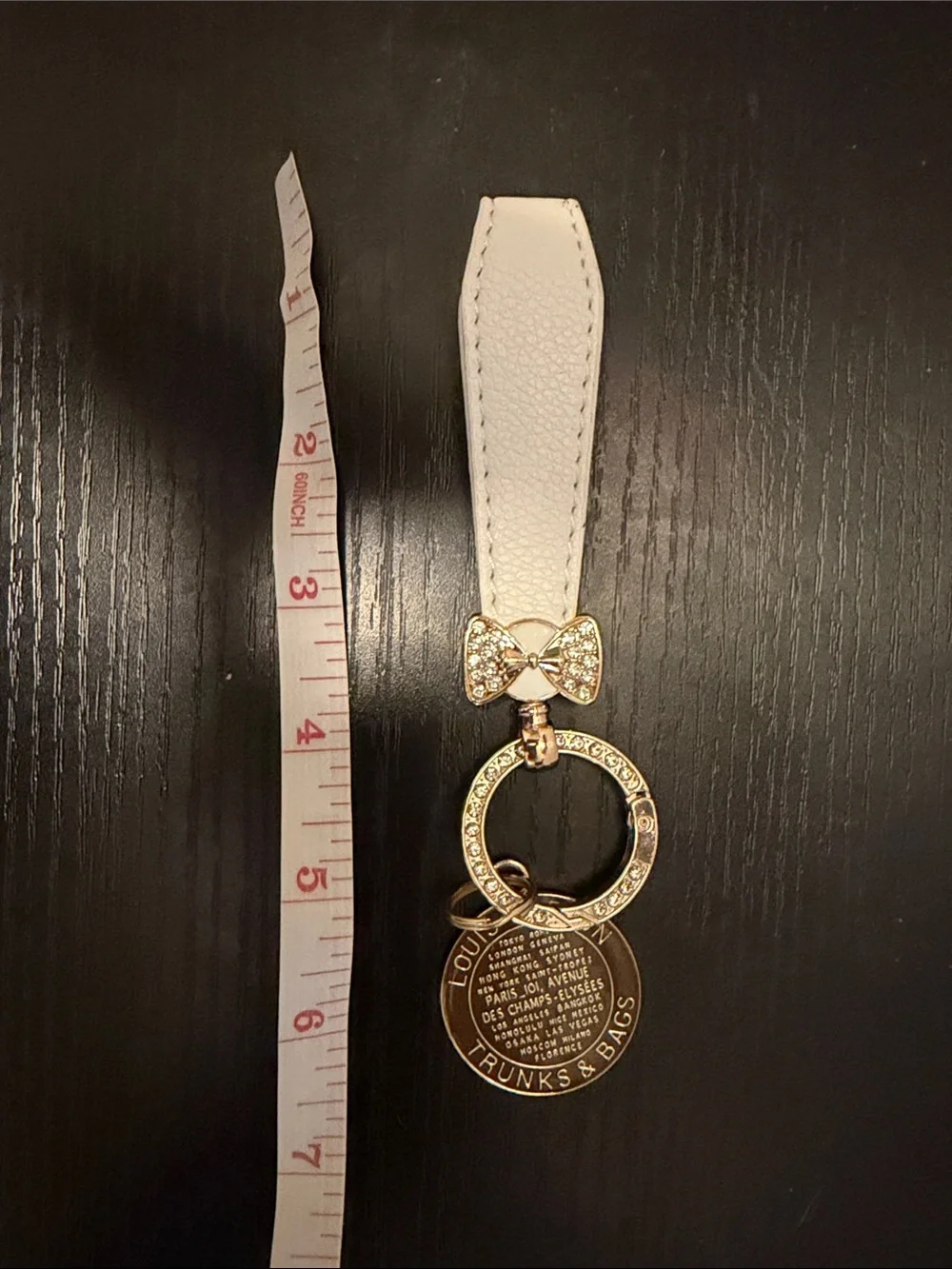 Inspired White Leather Strap Keychain with Brown Gold-Tone Medallion